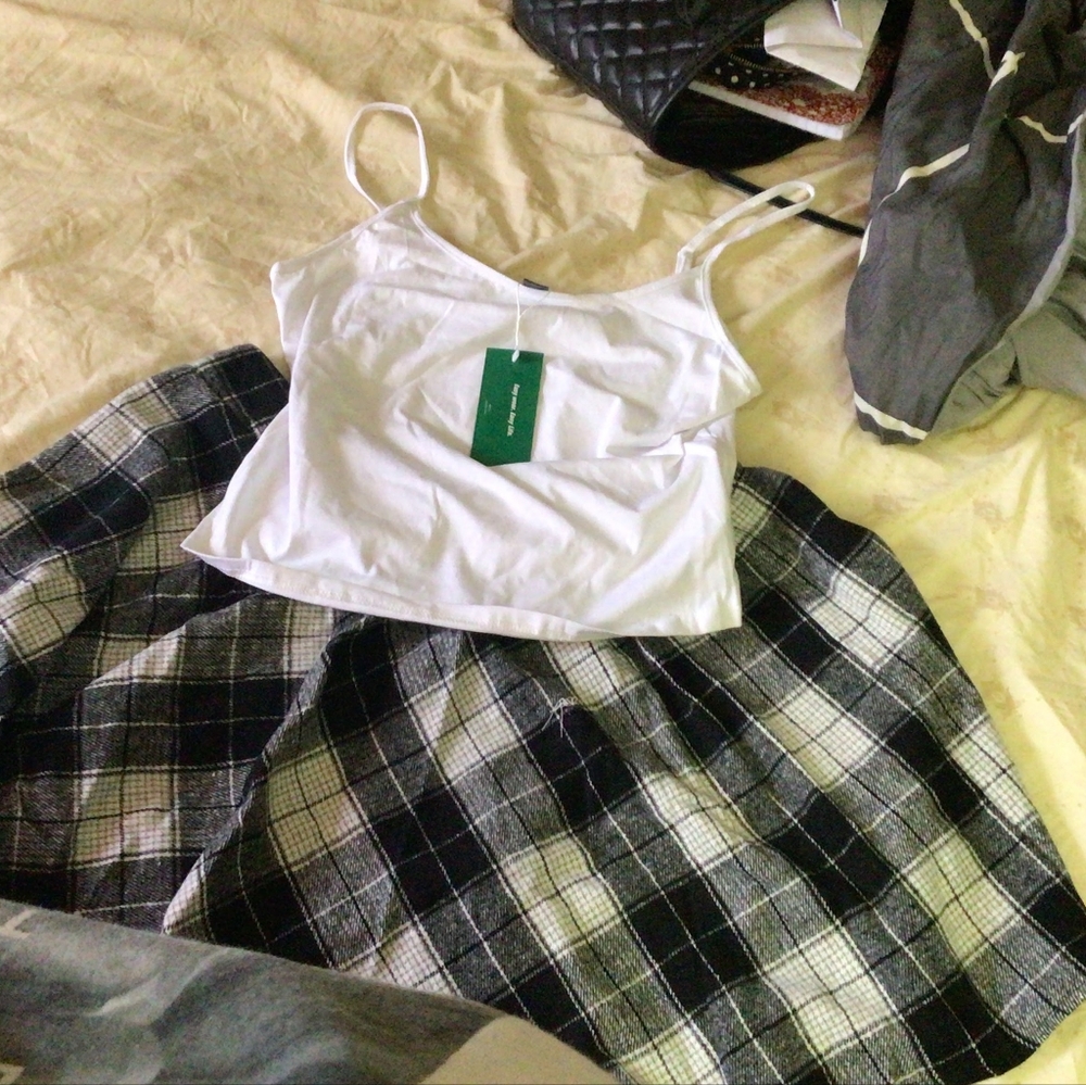 A mini tank top and plaid corduroy skirt